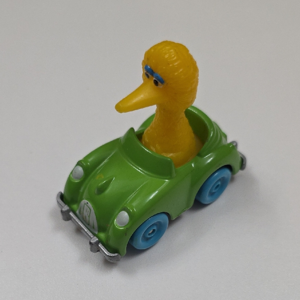 Vintage 1983 Playskool Sesame Street Big Bird die-cast car.